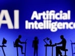 FILE PHOTO: Figurines with computers and smartphones are seen in front of the words "Artificial Intelligence AI" in this illustration created on February 19, 2024. REUTERS/Dado Ruvic/Illustration//File Photo