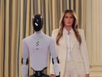 U.S. first lady Melania Trump walks next to a humanoid robot as she hosts a roundtable event on the second day of the inaugural Fostering the Future Together Global Coalition Summit, at the White House in Washington, D.C., U.S., March 25, 2026. REUTERS/Kylie Cooper