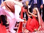 Uttarakhand Chief Minister Pushkar Singh Dhami during a mass kanya pujan programme at Sanatan Dharm Mandir in Prem Nagar, Dehradun, on Tuesday. The event was held during Chaitra Navratri and was attended by local public representatives and party functionaries.