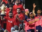 RCB team with the IPL trophy, Rajasthan Royals in IPL.