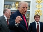 President Donald Trump speaks with reporters in the Oval Office of the White House, Tuesday, March 24