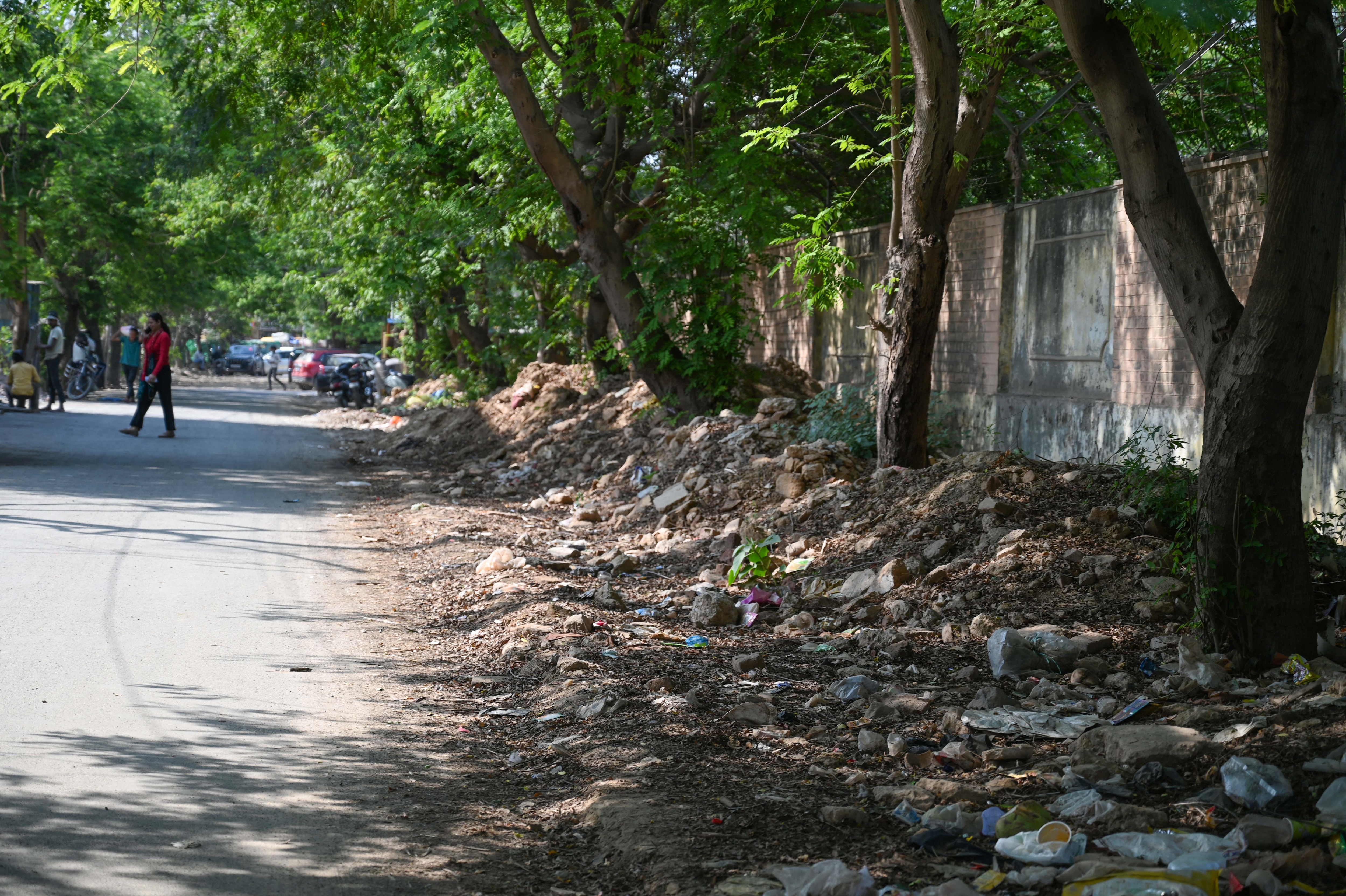 Illegally dumped waste along a pavement in Block-G, as seen on Tuesday. (Parveen Kumar/HT) Illegally dumped waste along a pavement in Block-G, as seen on Tuesday. (Parveen Kumar/HT)