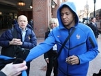 France's forward Kylian Mbappe signs autographs upon arriving at the hotel in Boston on March 24, 2026. 