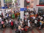 People queue up at a petrol pump amid rumours of fuel shortage in the wake of the West Asian conflict, in Prayagraj, Uttar Pradesh, Thursday, March 26, 2026.