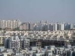 Revised rates apply where allotments pending; buyers to pay differential amount, developers cite rising costs. (Parveen Kumar/HT)