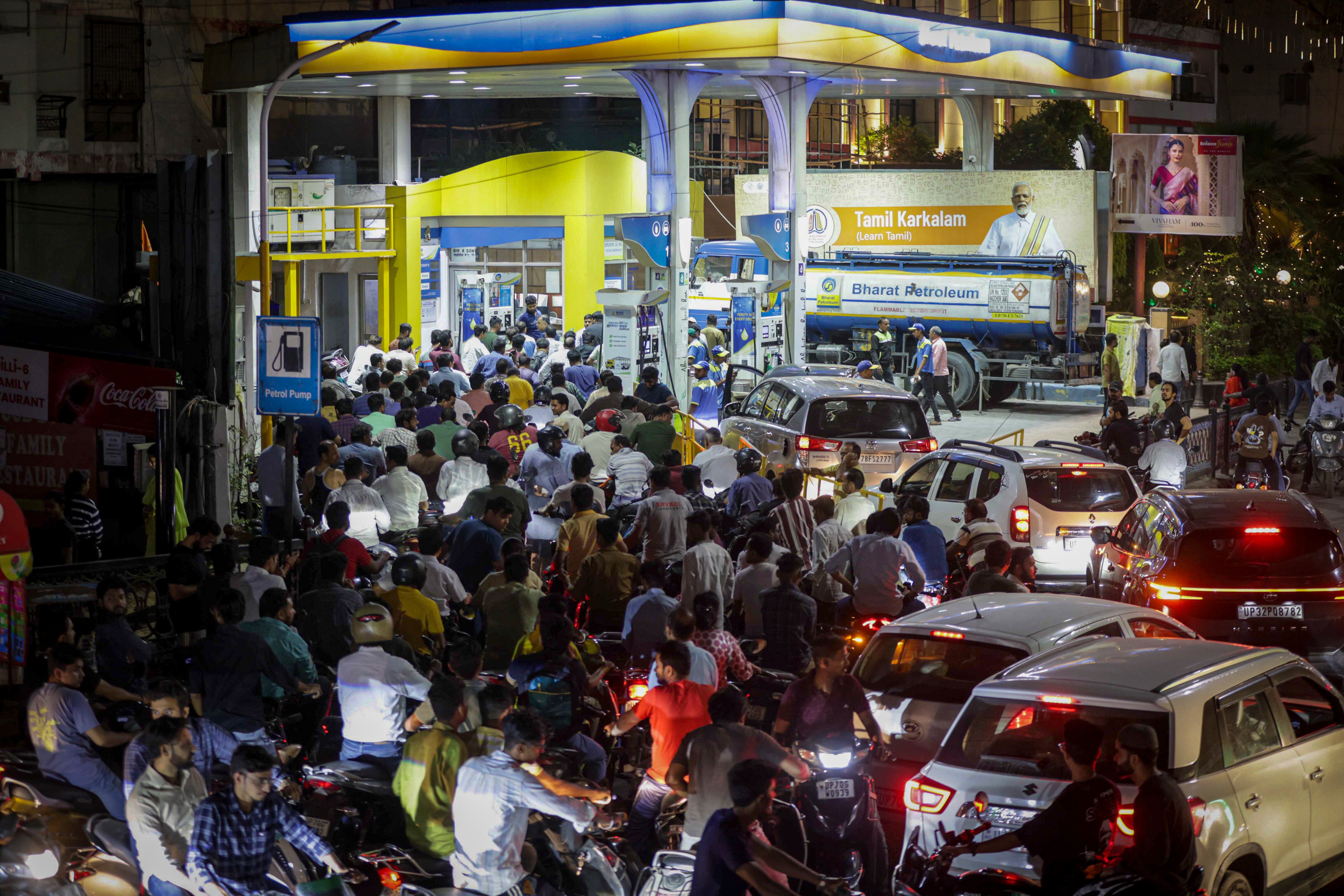 People queue up at a petrol pump amid rumours of fuel shortage in the wake of the West Asia conflict, in Prayagraj, Uttar Pradesh. (PTI Photo) People queue up at a petrol pump amid rumours of fuel shortage in the wake of the West Asia conflict, in Prayagraj, Uttar Pradesh. (PTI Photo)
