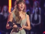 Taylor Swift accepts the award for Pop Album of the Year during the IHeartRadio Music Awards. (AP Photo/Chris Pizzello)