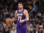 Los Angeles Lakers guard Luka Doncic (77) dribbles the ball down court during the second half against the Indiana Pacers at Gainbridge Fieldhouse.