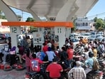 Commuters crowding a petrol station in Amritsar on Friday morning amid rumours of fuel shortage. (Sameer Sehgal/HT)