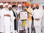 Haryana CM Nayab Singh Saini being felicitated during a religious congregation at Gurdwara Sri Nanaksar Sahib in Ludhiana on Thursday. (ANI)