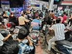 People queue to fill petrol at a petrol pump at Vashi, in Navi Mumbai, India, on Thursday