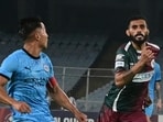 Players vie for a ball during the Indian Super League (ISL) match between Mumbai City FC and Mohun Bagan Super Giant, at Salt Lake Stadium in Kolkata. (PTI)