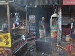 The blaze destroyed the food inventory and wooden furniture inside the shop. (HT Photo)