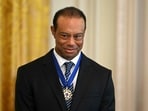 Tiger Woods looks on as unseen US President Donald Trump speaks during a reception for Black History Month Tiger Woods looks on as unseen US President Donald Trump speaks during a reception for Black History Month