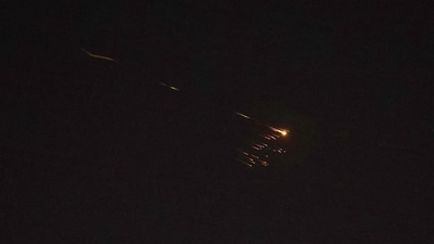Rocket trails are seen in the sky amid a fresh barrage of Iranian missile attacks above the Israeli coastal city of Netanya on March 27, 2026. (AFP) Rocket trails are seen in the sky amid a fresh barrage of Iranian missile attacks above the Israeli coastal city of Netanya on March 27, 2026. (AFP)
