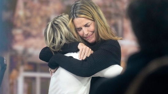 Savannah Guthrie hugs Dylan Dreyer during a visit to the Today show at Rockefeller Plaza in New York (Charles Sykes/Invision/AP)