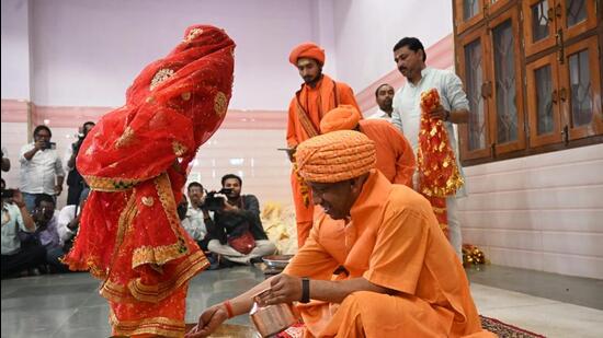 Uttar Pradesh chief minister Yogi Adityanath performs rituals during Kanya Pujan at Gorakhnath temple in Gorakhpur on Friday. (HT Photo)