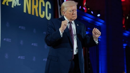 Trump's signature will replace the Treasurer's on dollar bills. Social media reactions are polarized, with critics viewing it as self-promotion. (Chip Somodevilla/Getty Images/AFP Photo)