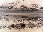 Aerial view of destroyed Iraqi vehicles beside Highway 80, west of Kuwait City. The ‘Highway of Death ‘ was bombed by coalition forces on February 27-28 1991 during Gulf War 1. (Shutterstock)