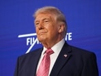 US President Donald Trump takes the stage at the Future Investment Initiative Institute's summit.