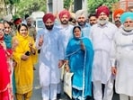 Baghapurana MLA Amritpal Singh Sukhanand flanked by newly elected block samiti chairperson Sarabjit Kaur (in yellow suit), and Congress’ Charanjit Kaur, who was elected vice-chairperson on Saturday. (Sanjeev Kumar/HT)