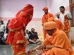 Uttar Pradesh chief minister Yogi Adityanath performs rituals during Kanya Pujan at Gorakhnath temple in Gorakhpur on Friday. (HT Photo)