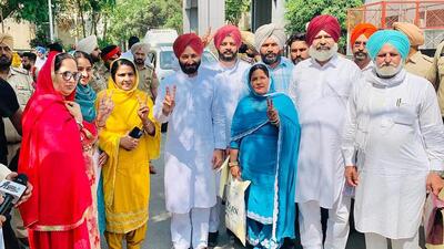 Baghapurana MLA Amritpal Singh Sukhanand flanked by newly elected block samiti chairperson Sarabjit Kaur (in yellow suit), and Congress’ Charanjit Kaur, who was elected vice-chairperson on Saturday. (Sanjeev Kumar/HT) Baghapurana MLA Amritpal Singh Sukhanand flanked by newly elected block samiti chairperson Sarabjit Kaur (in yellow suit), and Congress’ Charanjit Kaur, who was elected vice-chairperson on Saturday. (Sanjeev Kumar/HT)