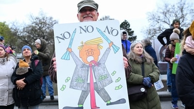 A demonstrator poses during a protest against U.S. President Donald Trump and his administration in front of St. Charles Church (Karlskirche) in Vienna, Austria, March 28, 2026. REUTERS/Elisabeth Mandl (REUTERS)