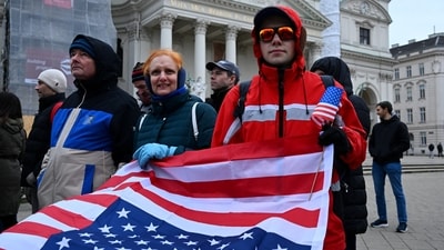 Demonstrators pose as they take part in a protest against U.S. President Donald Trump and his administration in front of St. Charles Church (Karlskirche) in Vienna, Austria, March 28, 2026. REUTERS/Elisabeth Mandl (REUTERS)