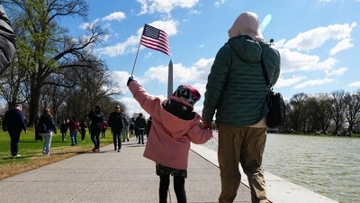 Demonstrators march along the reflecting pool near the Lincoln Memorial during the "No Kings" national day of protest in Washington, DC, on March 28, 2026. (AFP) Demonstrators march along the reflecting pool near the Lincoln Memorial during the "No Kings" national day of protest in Washington, DC, on March 28, 2026. (AFP)