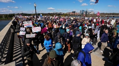 Protestors march across the Memorial Bridge from Arlington, Virginia into Washington, DC, during the "No Kings" national day of protest on March 28, 2026. (AFP) Protestors march across the Memorial Bridge from Arlington, Virginia into Washington, DC, during the "No Kings" national day of protest on March 28, 2026. (AFP)