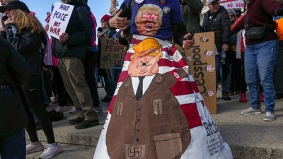 A demonstrator wearing a costume with a depiction of U.S. President Donald Trump attends a "No Kings" protest against the Trump administration's policies, near the Washington Monument in Washington, D.C., U.S., March 28, 2026. REUTERS/Leah Millis (REUTERS)
