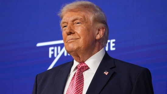 US President Donald Trump takes the stage at the Future Investment Initiative Institute's summit. (AP)