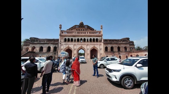 Vehicles parked in front of a Lucknow landmark, obscuring the view (HT Photo)