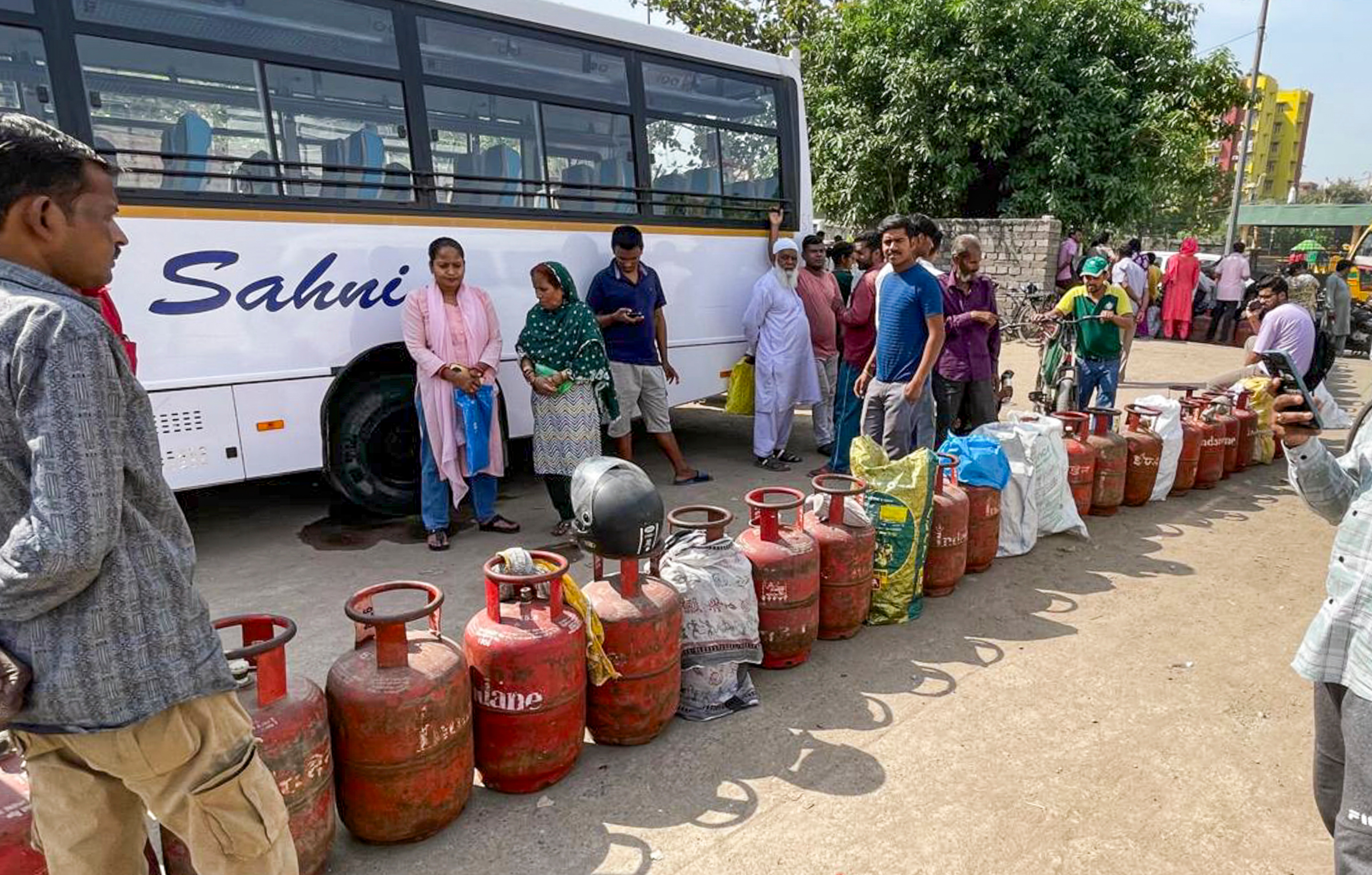 People queue up to avail LPG cylinders amid ongoing supply crunch, in Dilshad Colony, Delhi, Saturday, March 28 (PTI) People queue up to avail LPG cylinders amid ongoing supply crunch, in Dilshad Colony, Delhi, Saturday, March 28 (PTI)