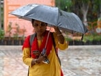 Noida, India-March 27, 2026:Commuters stepped out in Sector 19 amidst light afternoon rain, in Noida, India, on Friday, March 27, 2026. 