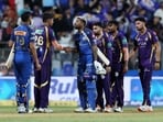 Mumbai Indians' Hardik Pandya shakes hands with Kolkata Knight Riders' Varun Chakaravarthy after the match