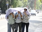 Girls shield their faces from the harsh sunrays on a hot, sunny Sunday in Lucknow. (Deepak Gupta/HT photo)