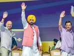 Punjab chief minister Bhagwant Mann with AAP national convener Arvind Kejriwal and party leader Manish Sisodia at the inaugural event at Fatehgarh Sahib on Saturday.