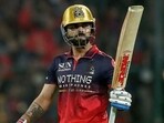 Royal Challengers Bengaluru's Virat Kohli celebrates after reaching his 50 against SRH on Saturday. (AFP)