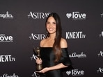 Olivia Munn, diagnosed with Stage 1 breast cancer, underwent surgeries to reduce her risk. She raised awareness online, leading to a surge in test participants. Married to John Mulaney,