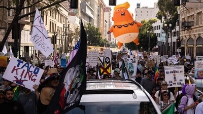 A giant inflatable balloon in the likeness of US President Donald Trump as a baby in diapers is seen as demonstrators march during the "No Kings" national day of protest in Los Angeles on March 28, 2026. (Photo by ETIENNE LAURENT / AFP) (AFP) A giant inflatable balloon in the likeness of US President Donald Trump as a baby in diapers is seen as demonstrators march during the "No Kings" national day of protest in Los Angeles on March 28, 2026. (Photo by ETIENNE LAURENT / AFP) (AFP)