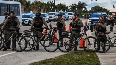 Police officers guard the access points in the vicinity of US President Donald Trump's Mar-a-Lago residence during the "No Kings" national day of protest, in Palm Beach, Florida, on May 28, 2026. (Photo by Giorgio VIERA / AFP) (AFP) Police officers guard the access points in the vicinity of US President Donald Trump's Mar-a-Lago residence during the "No Kings" national day of protest, in Palm Beach, Florida, on May 28, 2026. (Photo by Giorgio VIERA / AFP) (AFP)