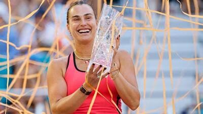 World No.1 Aryna Sabalenka of Belarus with the trophy after beating American Coco Gauff in the women's singles final of the Miami Open on Saturday. (AFP) World No.1 Aryna Sabalenka of Belarus with the trophy after beating American Coco Gauff in the women's singles final of the Miami Open on Saturday. (AFP)