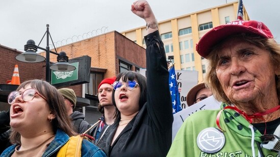 DALLAS, TEXAS - MARCH 28: People march through downtown in protest against the Trump administration during a "No Kings" demonstration on March 28, 2026 in Dallas, Texas. (Photo by Brandon Bell / GETTY IMAGES NORTH AMERICA / Getty Images via AFP)(Getty Images via AFP)