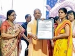 Chief minister Yogi Adityanath distributes appointment letters to anganwadi workers during an event, in Lucknow on Monday. (@CMOfficeUP/ANI Photo) Chief minister Yogi Adityanath distributes appointment letters to anganwadi workers during an event, in Lucknow on Monday. (@CMOfficeUP/ANI Photo)
