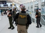 Immigration and Customs Enforcement (ICE) agents patrol at John F. Kennedy International Airport, New York City
