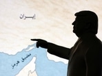 A 3D-printed miniature model depicting U.S. President Donald Trump and map showing the Strait of Hormuz, also known as Madiq Hurmuz, are seen in this illustration taken March 26, 2026. REUTERS/Dado Ruvic/Illustration