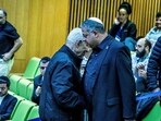 Israeli Prime Minister Benjamin Netanyahu and Israel's far-right national security minister Itamar Ben-Gvir shake hands as they attend a session at the Knesset, Israeli parliament, in Jerusalem. (Reuters)