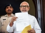 JD(U) MLC Sanjay Gandhi displays Nitish Kumar’s resignation letter from the Bihar Legislative Council at the Bihar Vidhan Sabha in Patna on Monday. (ANI photo)